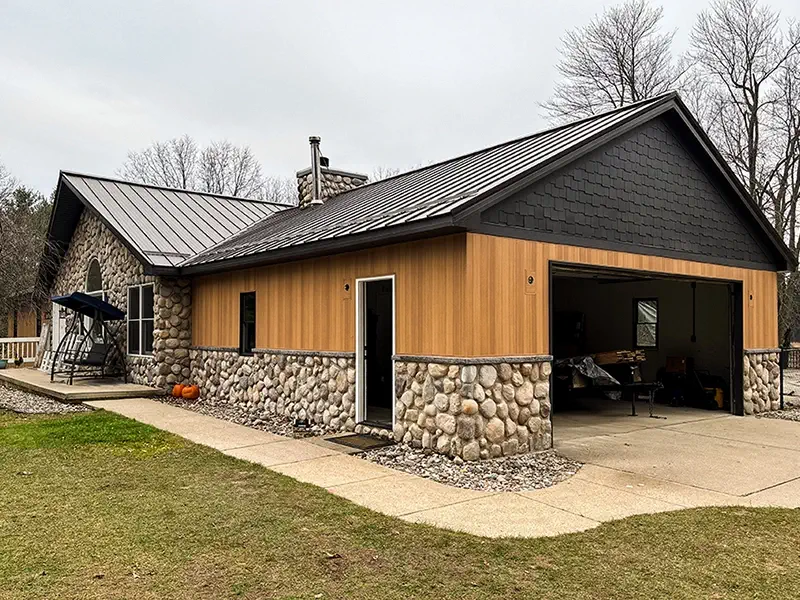 Black Metal Roofing, Natural Wood Siding by Veteran Roofing and Exteriors, LLC